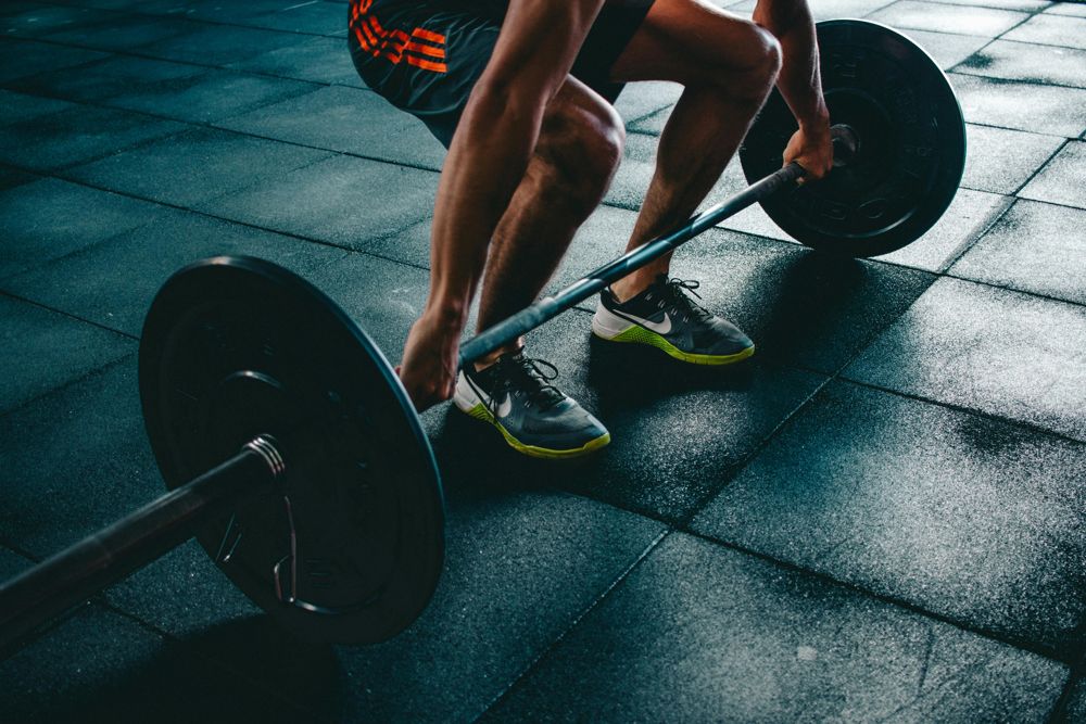 man lifting barbell background